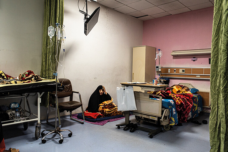 Sixty-year-old Shia Abbas, from Nassiriya, spends the night sleeping on the floor next to her nephew, Ali Saad Hashem, 11, who has been undergoing treatment for leukemia at Basra Children’s Hospital for the past six months. The paediatric oncology ward has 45 beds and many children spend weeks or even months in the hospital