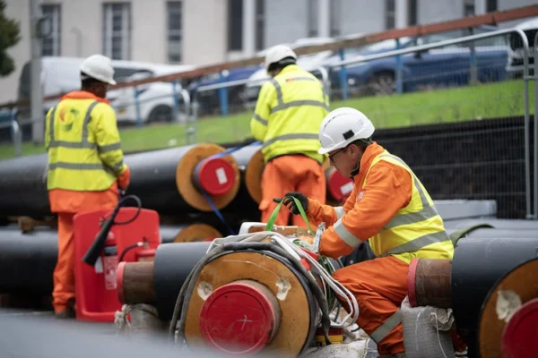 Engineers fitting the Bradford Energy Network Pipes