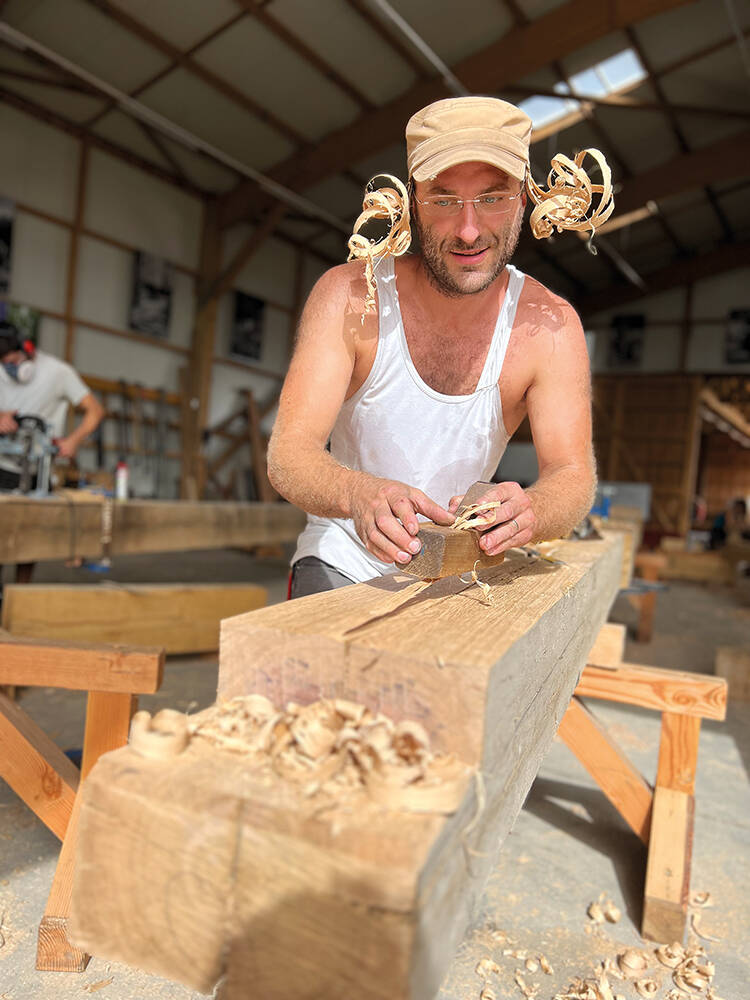 Mathieu Larigot hand planes an oak beam