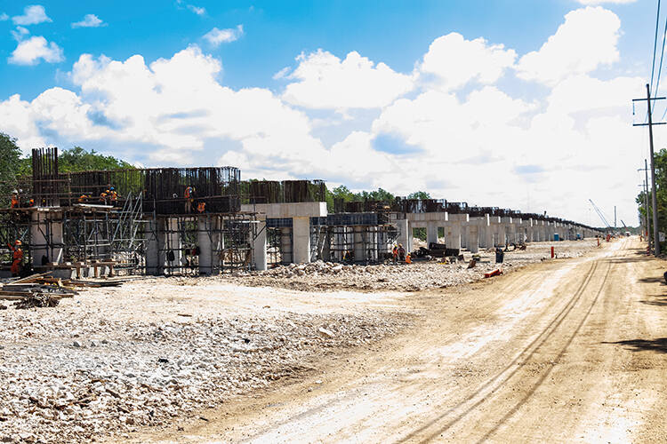 The viaduct being built through the jungle - each of the support pillars descends into the fragile cenote system