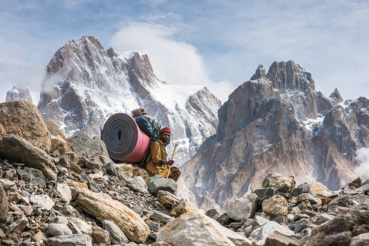 A man sits atop Baltoro Glacier in northern Pakistan