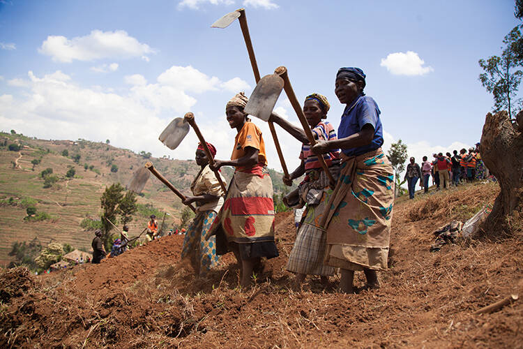 Women digging terraces as part of the national compulsory monthly community work scheme