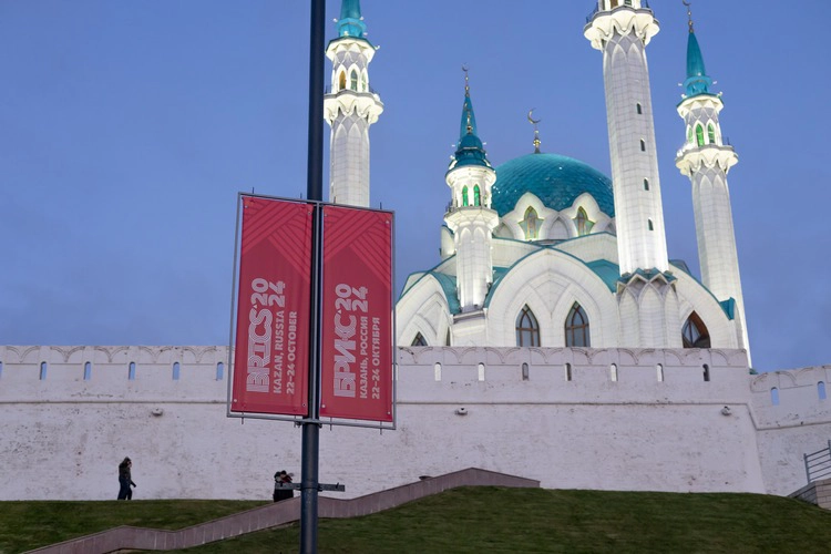 Kazan, Russia - October 18, 2024: BRICS 2024 Russia logo with the city of Kazan in the background.