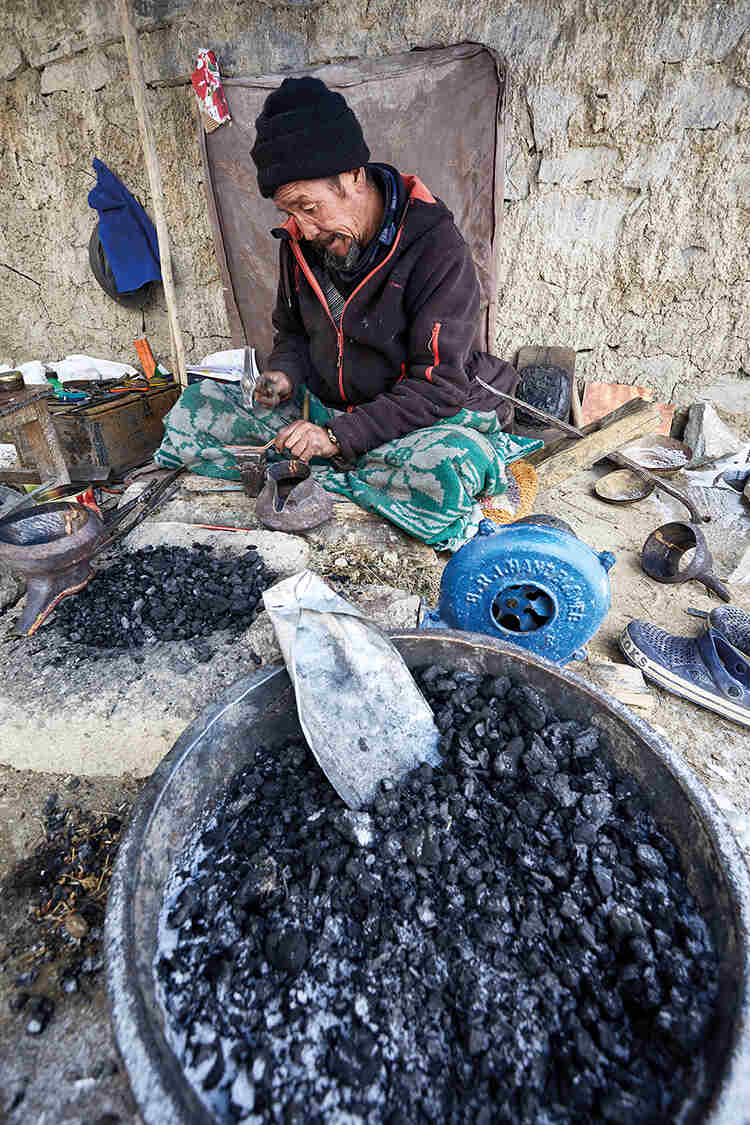 Copper pot maker, Rigzin Chosdup, who lost 40 sheep to a snow leopard in one night