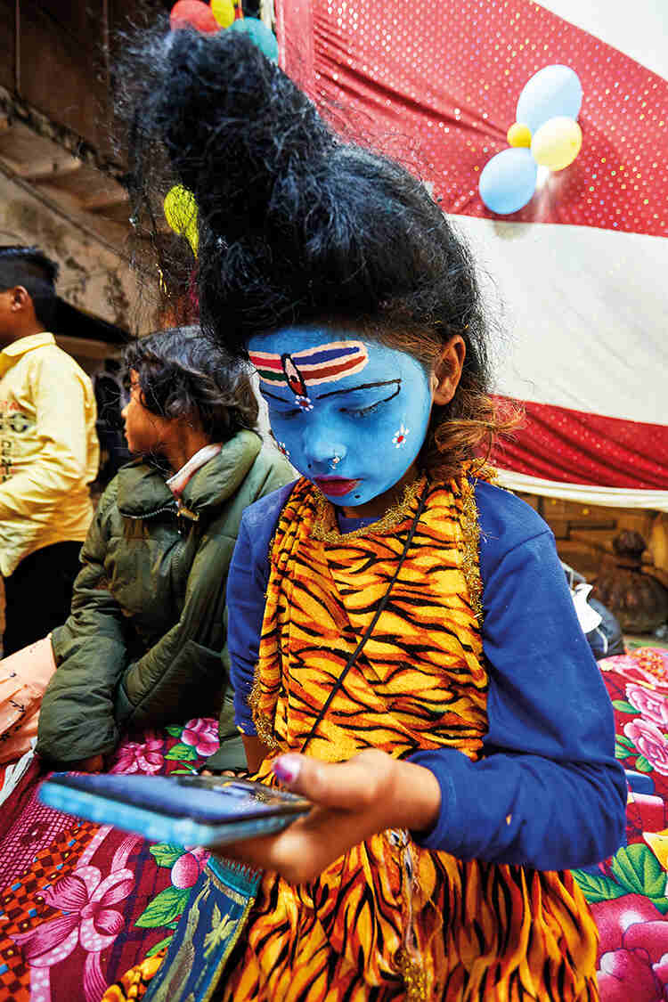 A child waiting to take part in a religious ceremony