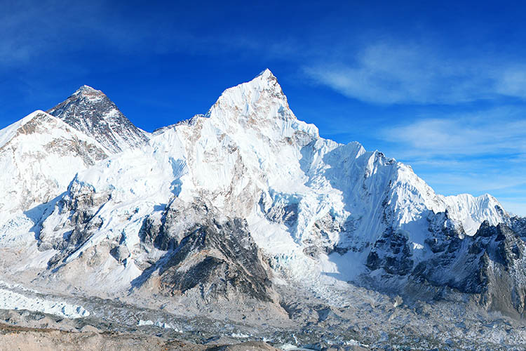 Panoramic blue colored view of himalayas mountains, Mount Everest and Khumbu Glacier from Kala Patthar - way to Everest base camp, Khumbu valley, Sagarmatha national park, Nepalese himalayas