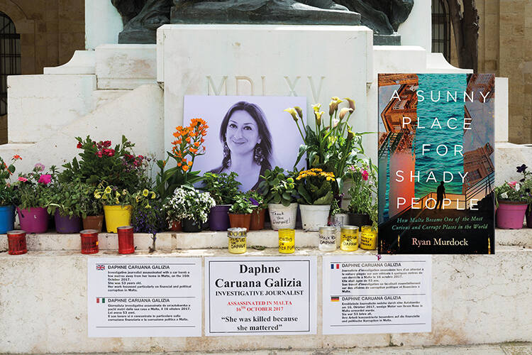Photographs, candles and messages in Valletta, demanding justice for the murdered journalist Daphne Caruana Galizia