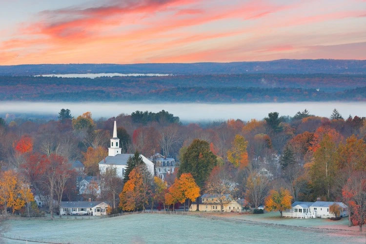 Overlooking a peaceful New England Farm in the autumn at sunrise with frost on foreground, Boston, Massachusetts, USA