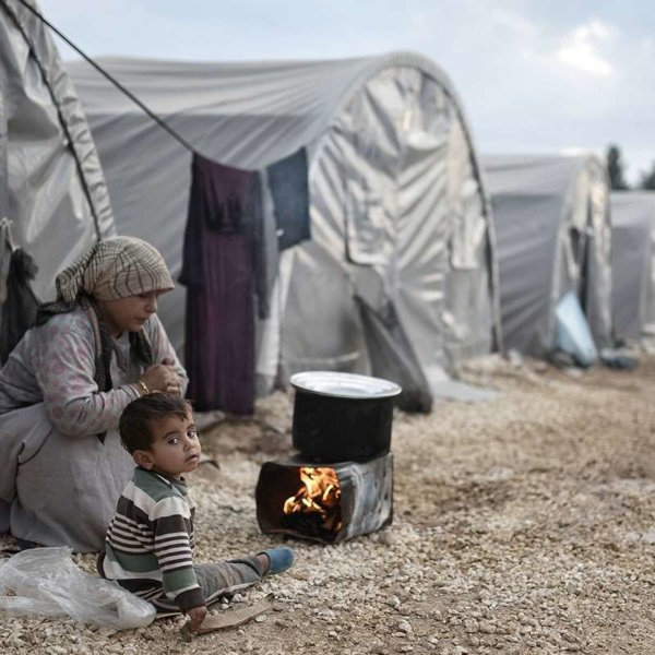 Syrian refugees in a migrant camp outside Aleppo