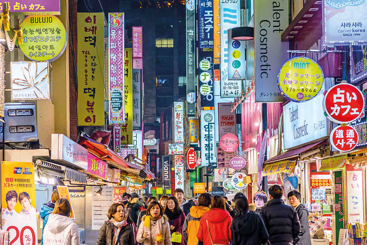 A busy market street in the Myeong-Dong district, Seoul, South Korea