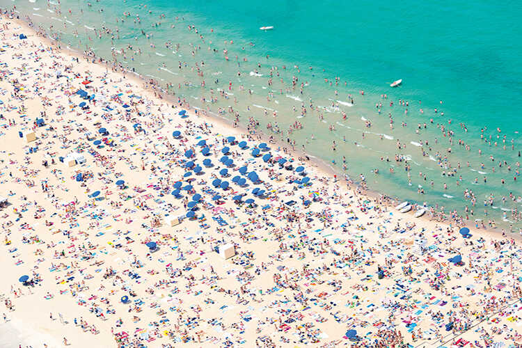 A busy day on North Avenue Beach on Lake Michigan, one of Chicago’s most popular beaches. The first City of Chicago public beach, North Avenue opened in Lincoln Park in 1895. Much of the beach’s area is made up of a landfill that took place during the 1930s