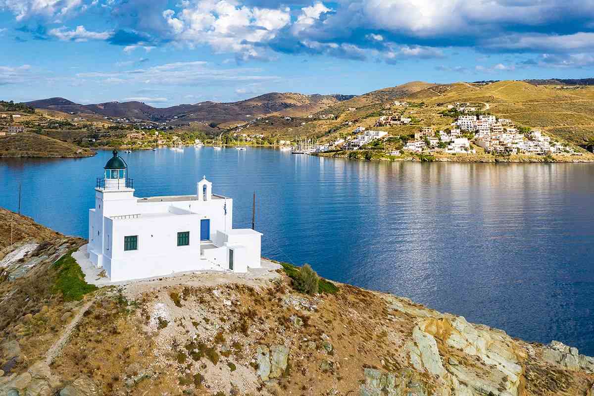 Chapel lighthouse of St Nicholas overlooking water from a cliff, Kea, Greece