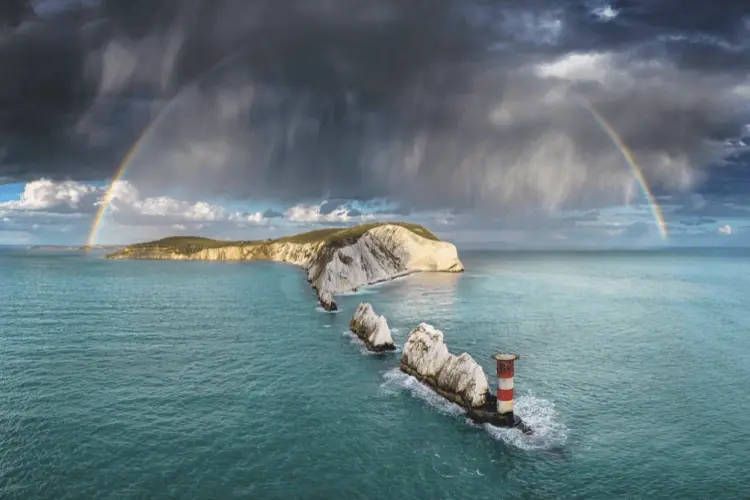 An evening shower over the Needles, Isle of Wight, UK, by Jamie Russell. Main category, third place