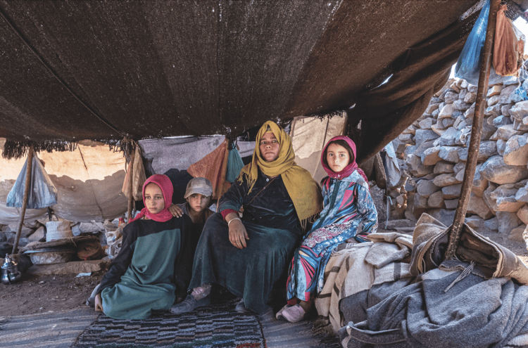 Touda Ihssissn, 35, and her children Maryam, 15; Fatima, 13; and Rachid, 11, are nomads from the Amazigh tribe who live among the mountains of the High Atlas, sleeping in tents made of camel wool and goat hair. Over the past twenty years, due to drought and increasing desertification, food for raising animals has become increasingly scarce, and many Ait Atta families have given up their nomadic lifestyle to move to urban areas in search of work.