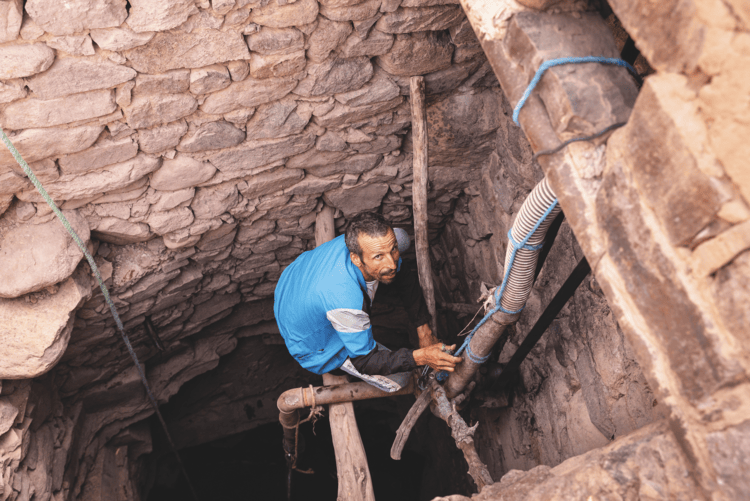 Issam Moha, 46, a nomad belonging to the Afourer community, descends into a well to check the water level among the mountains of Jbel Saghro. The precariousness of the water supply makes each visit to the well a moment of great anxiety and anticipation.