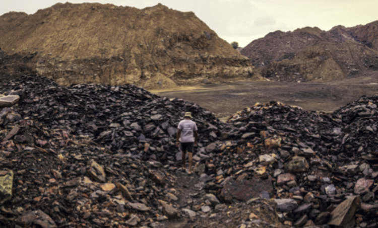 ohn Mthembu walks inside a mine in the Vosman area in Witbank, Emalahleni