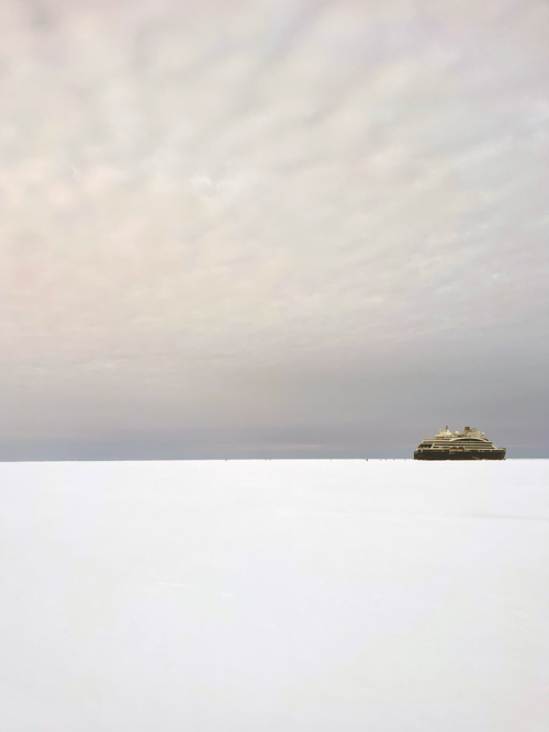 The horizon stretches infinitely – the same flat expanse and whiteness everywhere