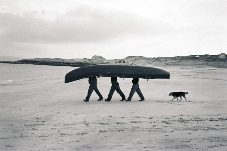Newby took this photograph during
a cycling trip to Ireland. He described
the fishermen as looking like a
‘strange six-legged monster’