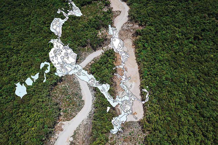 A map of part of the Sac Actun and Dos Ojos cave network superimposed on an aerial photograph of the area above it being cleared for the train line. This is one on the largest and most celebrated cenotes to be explored and the train line runs over many of its most stunning features.