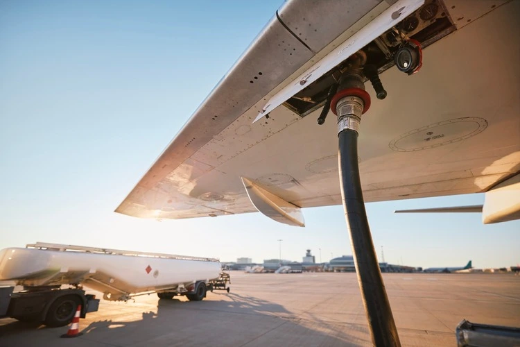 Refueling of airplane at airport. Ground service before flight.