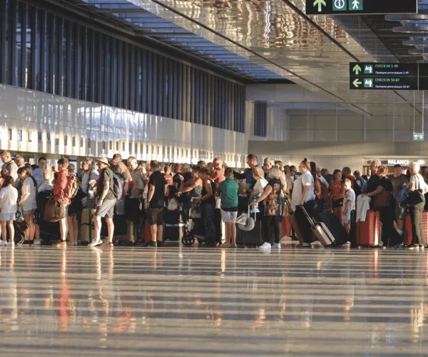 Holidaymakers queue at Dalaman Airport, Turkey.