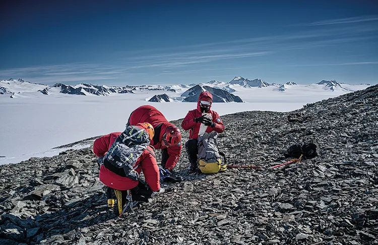 Collecting soil samples to look for traces of meteorites