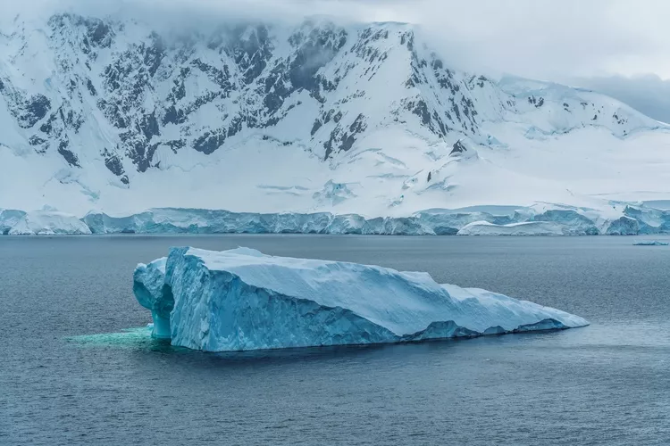 Huge Floating Iceberg in Antarctica. Beautiful Natural Destination Near South Pole. Adventure Travel View From Ship Melting Icecaps Climate Change