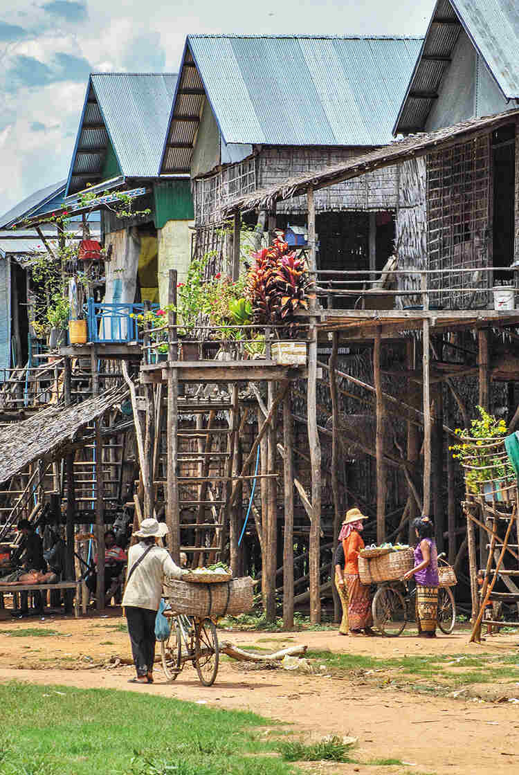 Houses stand on stilts in the village of Kompong Phluk. Before the recent erratic weather, they would have been surrounded by water five months a year
