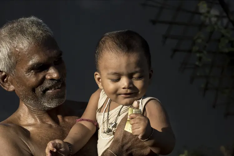 Child held up by man