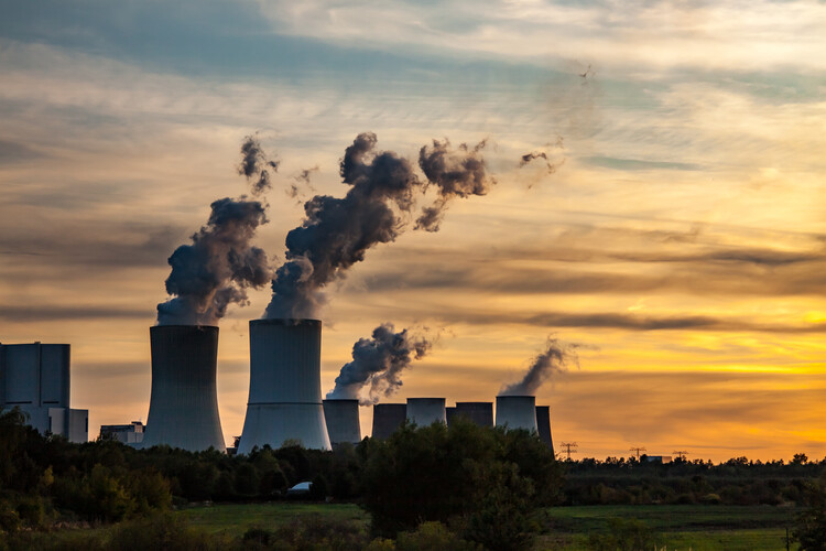 View of a coal-fired power station at sunset