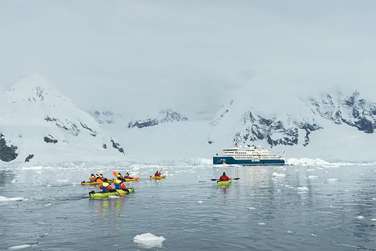 Expedition cruises offer low-impact activities such as kayaking in Antarctica’s Charlotte Bay
