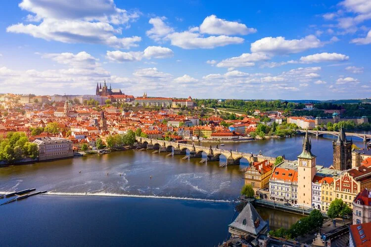 Scenic view of the Old Town pier architecture and Charles Bridge over Vltava river in Prague, Czech Republic.