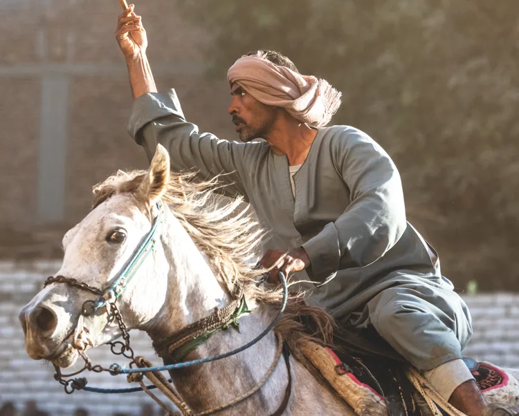 A rider on a white horse during the Mermah