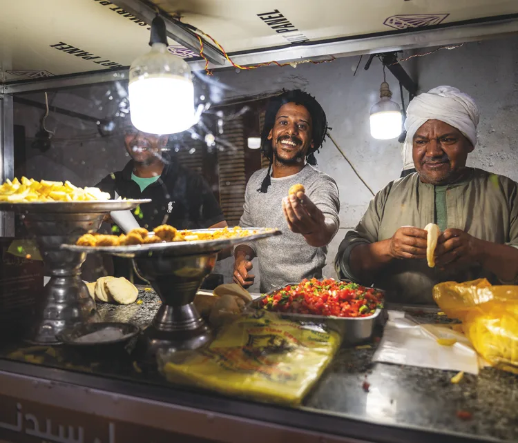 Street vendors preparing Egyptian food for spectators