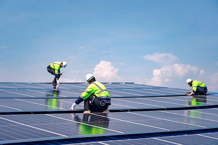 Engineers are installing solar panels