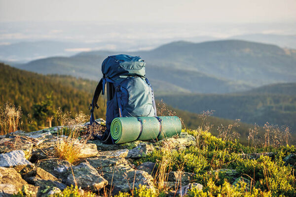 Walking gear overlooking hills and mountains
