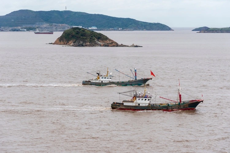 Fishing boats sailing near the Chinese coast.