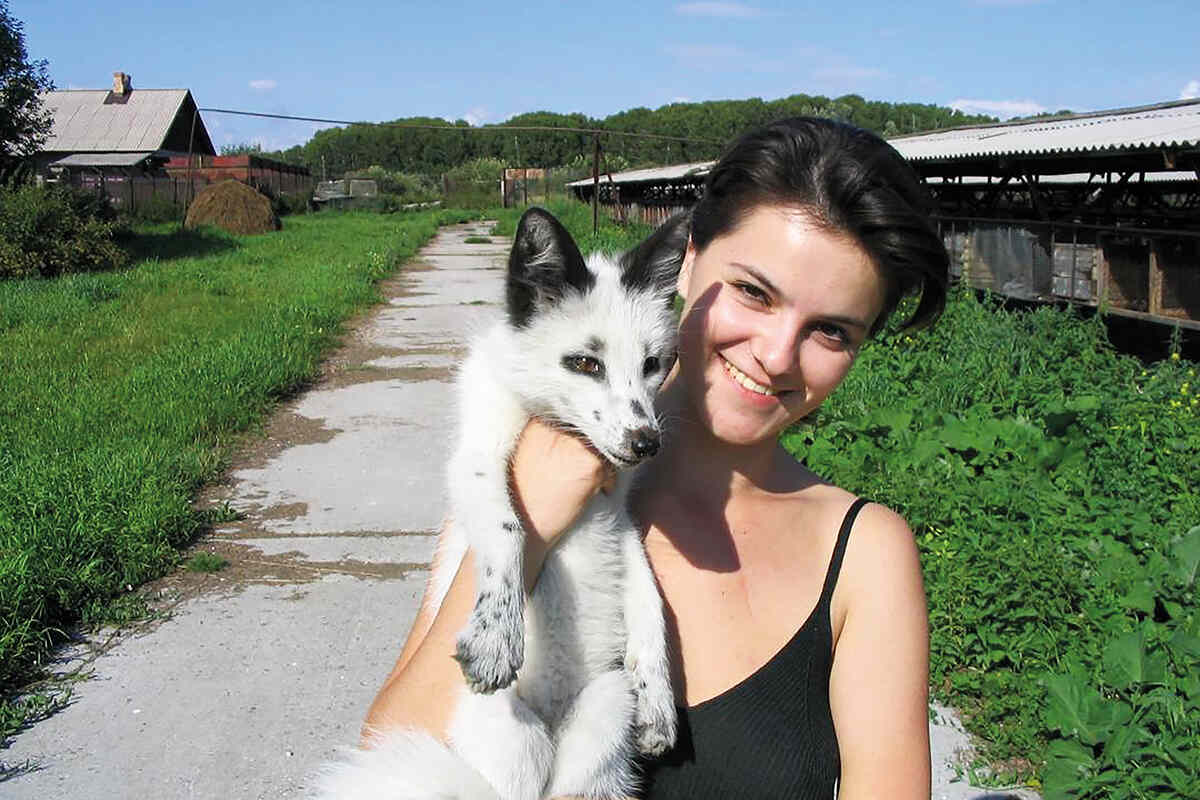 Young woman holding one of Dimitry Belyaev's domesticated foxes