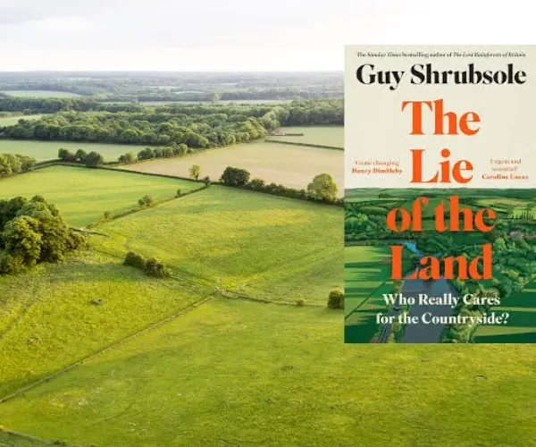 Image of Guy Shrubsole's book 'Lie of the Land' against a green field