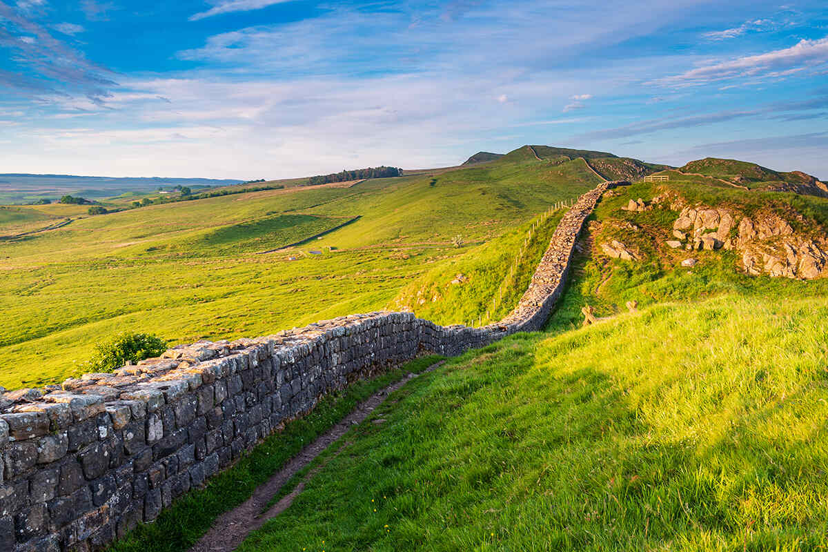 A view of hadrians wall over sprawling fields