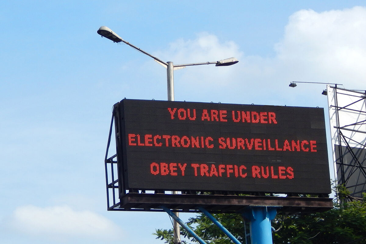 An LED sign warns civilians they are under surveillance 