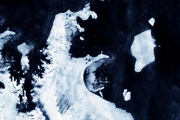 Icebergs breaking off in the sea from Antarctica.