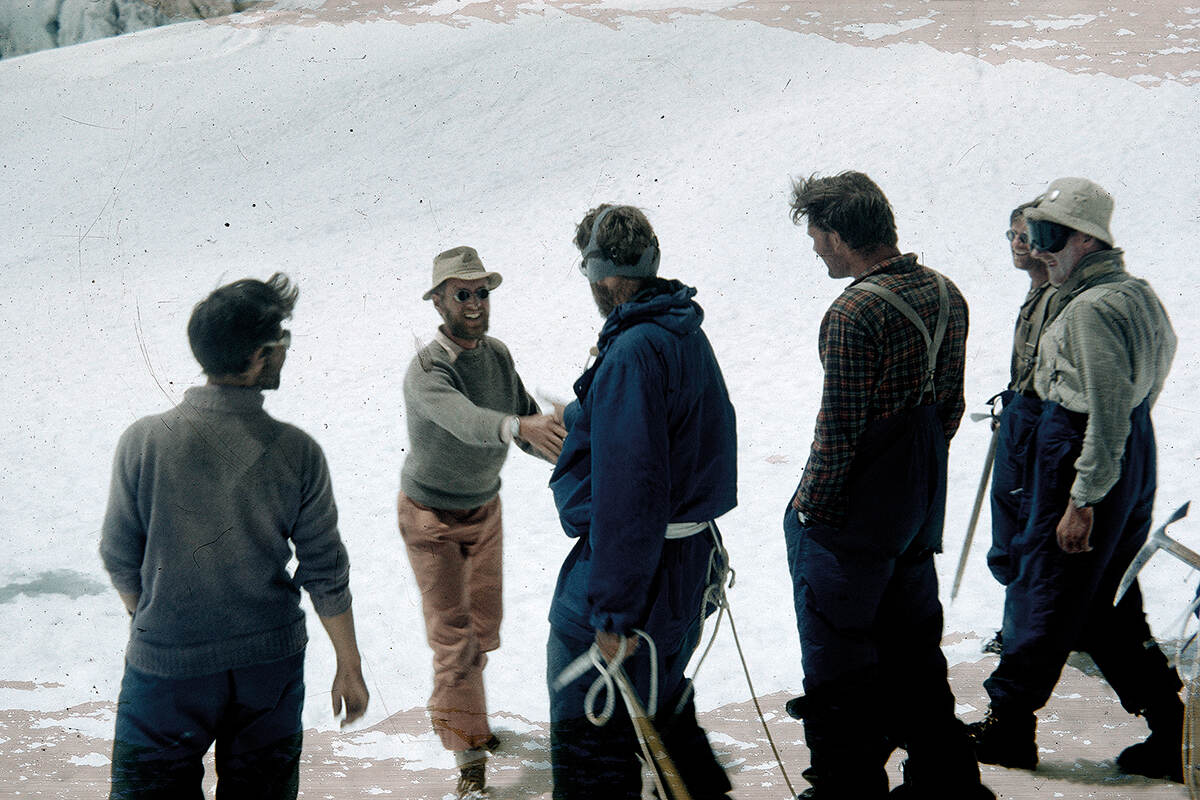 James Morris congratulates Edmund Hillary as he returns from his successful attempt to reach the summit of Mount Everest