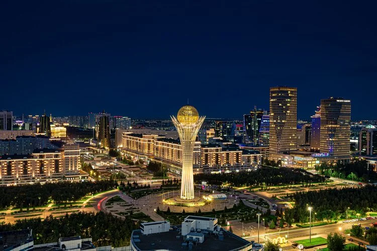 Astana, Kazakhstan– July 16, 2024: Aerial view of the town at night and the Baiterek Tower in Astana (NurSultan), Kazakhstan