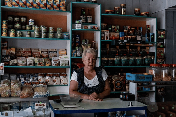 Lavisha behind her shop counter.