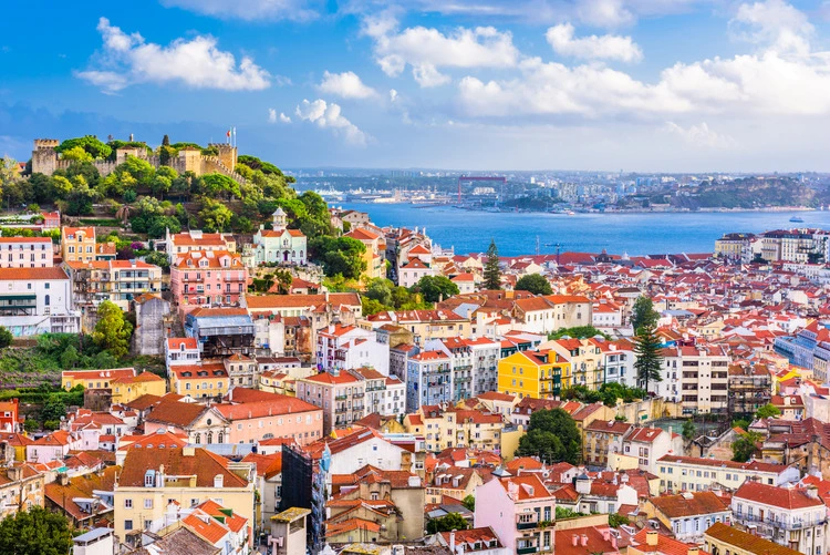 Lisbon, Portugal City Skyline with Sao Jorge Castle and the Tagus River.