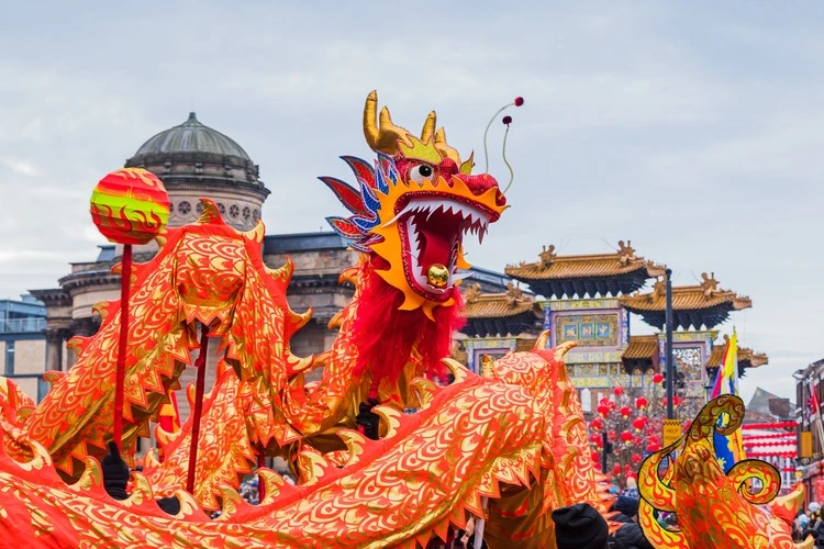 Close up of the beautifully decorated dragon performing its traditional Chinese New Year dragon dance in Liverpool seen in January 2023.