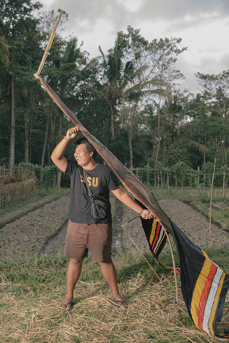 man holding kite