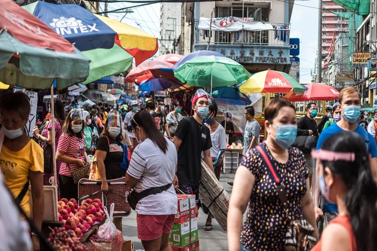 Divisoria, Manila, Philippines - Oct 2020: A bustling scene along Ilaya Street - A crowded, narrow street filled with shops and people.