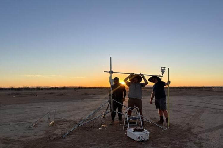 Researchers Adam Brandt, Josh Romo, and Taylor Adams set up a meteorology station during preparations for controlled methane releases.